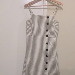 This beautiful black n white striped dress with wooden buttons running alongside